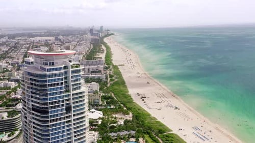 Panoramic View of the Beach Line Between the Ocean and the Coastal City. Aerial View