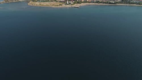 Coastline with Beach and Lighthouse