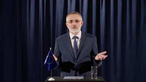 Man Giving Presentation with European Union Flag