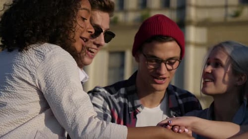 Happy Young Friends Celebrate Success Together