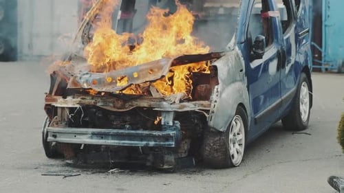 Car Burns After a Road Accident