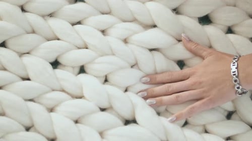 The Girl Is Stroking the Merino White Plaid. Hand Close-up.
