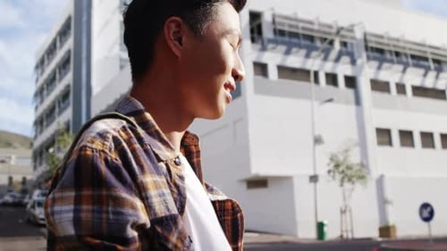 A man texting on the street