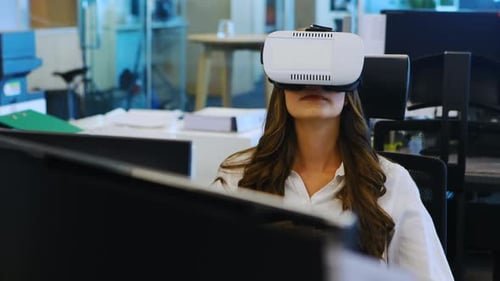 Woman Wearing VR Headset Interacting with Virtual Interface