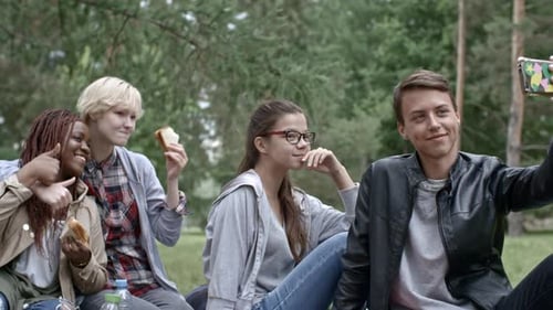 Teens Taking Selfie on Lawn in Park