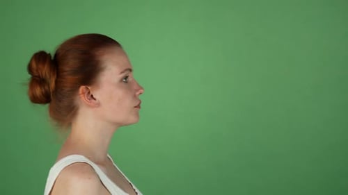 Young Woman Screaming on Green Chromakey Background