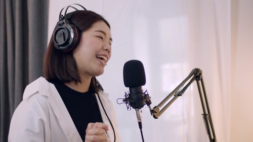 Woman Recording Podcast in Home Studio
