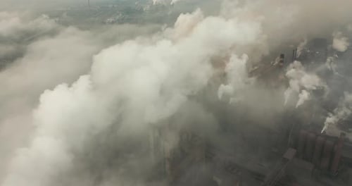 Top View of the Metallurgical Plant. Smoke Coming Out of Factory Pipes. Ecology