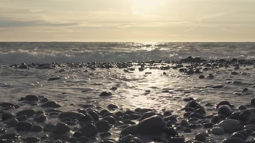 Tidal Bores on Stoneshore of Sea, Solar Path Is on Surface