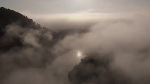 Fog and Mist Rolling Over Mountain Valley