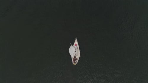 Sailboat on a Calm Lake from Above