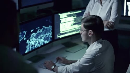 Programmers Work at Computers in Brightly Lit Office