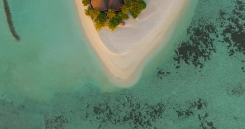 Aerial drone view of a scenic tropical island in the Maldives.