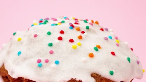 Cupcake with White Sweet Icing and Assorted Small Urps