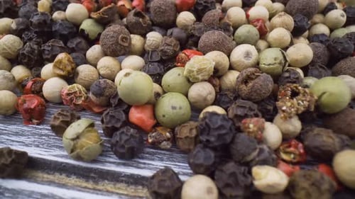 Colorful Peppercorns on Wooden Surface, Close Up