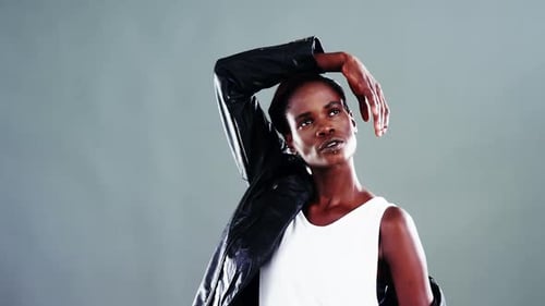 Woman Posing in Studio Wearing Leather Jacket