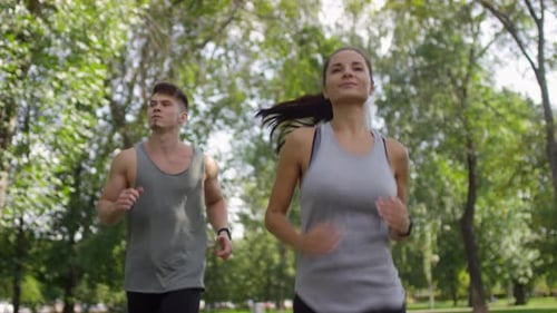 Beautiful Couple Enjoying Run in Park