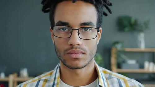 Young Adult Portrait with Dreadlocks and Glasses