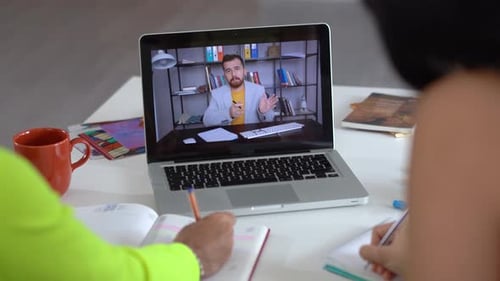 Students Taking Virtual Lesson on Laptop