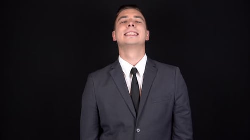 Young Adult Smiling Wearing a Gray Business Suit