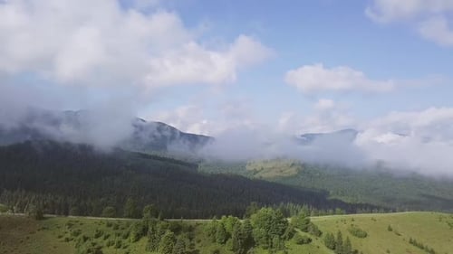 Aerial View of Mountain Range with Clouds