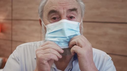 Close up portrait of man wearing protective mask. Concept of health and safety life. Elderly man dur