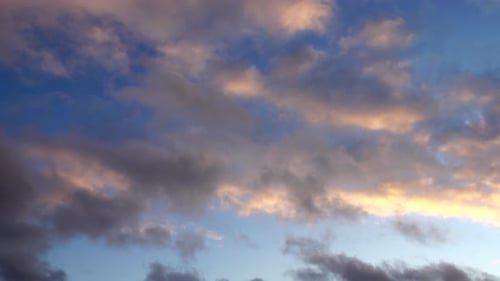 Golden Clouds Above a Blue Sky at Sunrise