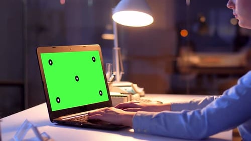Businesswoman with Green Screen on Laptop at Night 69