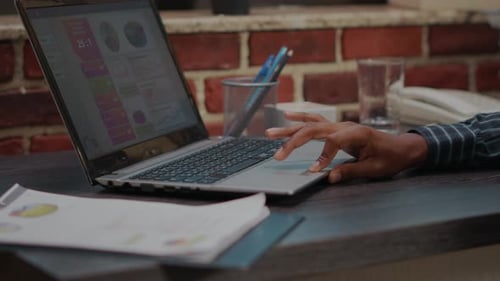 Hands Typing on Laptop at Office Desk