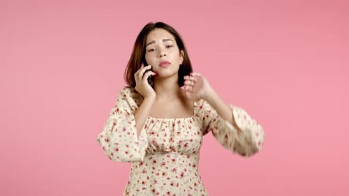 Woman Looking Distressed on Phone Call