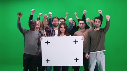 Protest Movement Female Activist Holding a Protest Poster a Protesting Crowd in the Background