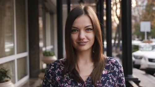 Portrait of Young Beautiful Businesswoman Looking at Camera, Happy and Smile on the Street