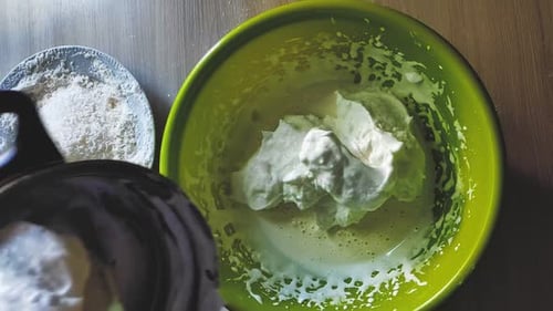 Adding Cream to Bowl for Baking Dessert