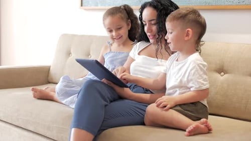 Mother and Children Using Tablet at Home