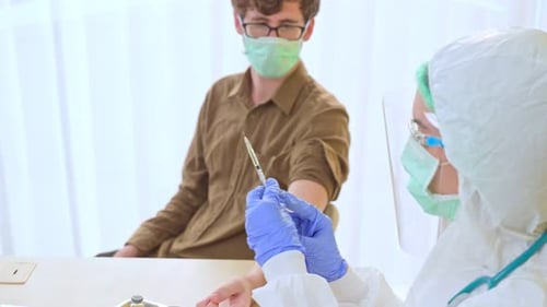 Close up of doctor, nurse or scientist holding flu, measles, coronavirus vaccine shot for diseases.