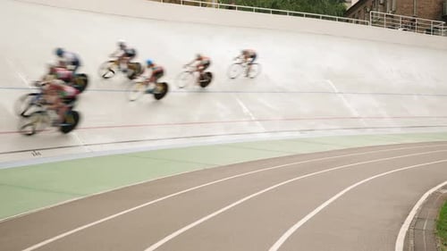 Professional cycling teams racing on open velodrome. Cycling track.