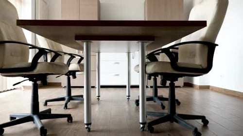 Empty Conference Room with Data on Screen