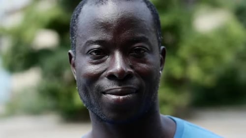 Smiling Man Close Up Outdoors in Natural Light