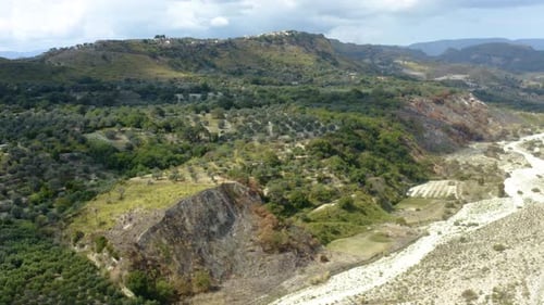 Scenic Aerial View of Green Hills and Riverbed