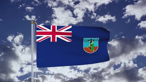 Montserrat National Flag Waving in Cloudy Blue Sky