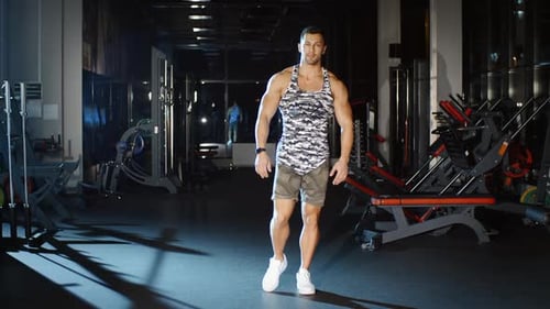 Athletic Man Workout and Trains Legs Joins and Knees Circle Exercises