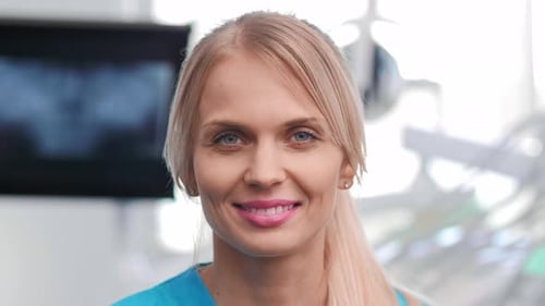 Portrait of smiling dentist in dentist's clinic