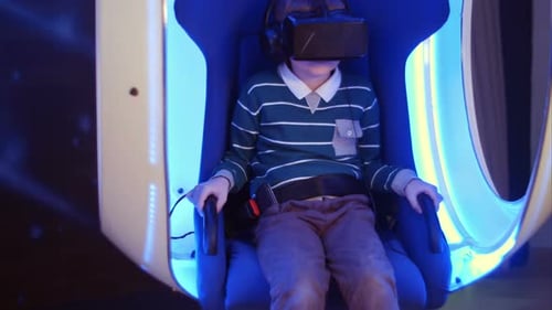 Excited Boy Enjoying Virtual Reality Attraction