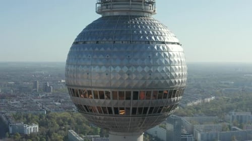 AERIAL: Super Close Up View of the Alexanderplatz TV Tower in Berlin, Germany on Hot Summer Day