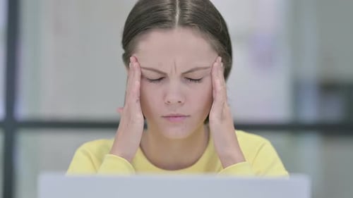 Close Up of Woman Having Headache While Using Laptop