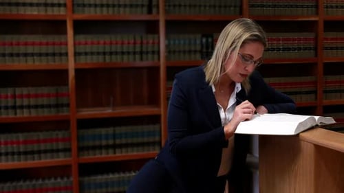 Librarian Reading and Writing in Book