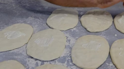 Brushing Cream on Raw Dough in Food Preparation