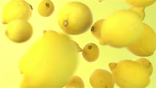 Vibrant Yellow Lemons Falling Seamless Loop Background