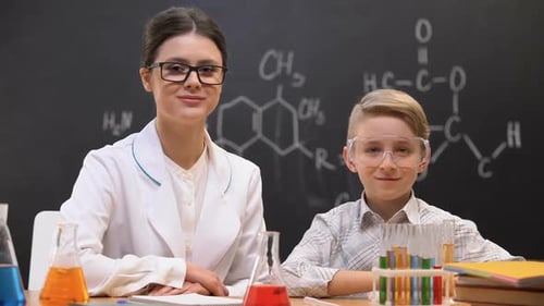Teacher and Student in Chemistry Classroom