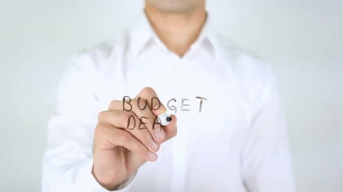 Writing Budget Deals on Clear Surface